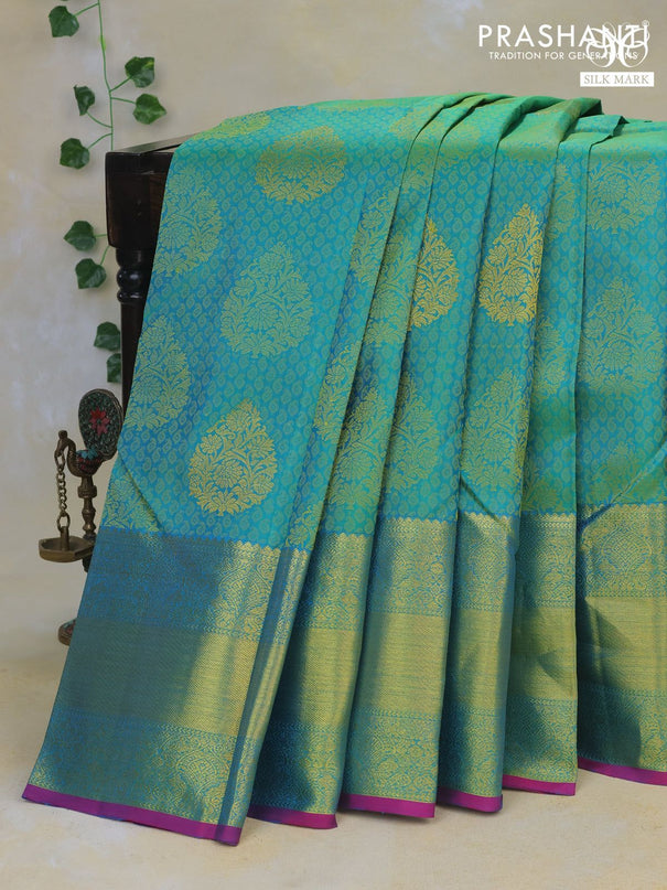 Pure kanchipuram silk saree dual shade of teal green and magenta pink with allover thread woven brocade weaves and rich zari woven border