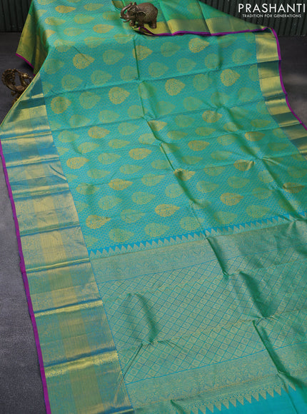 Pure kanchipuram silk saree dual shade of teal green and magenta pink with allover thread woven brocade weaves and rich zari woven border