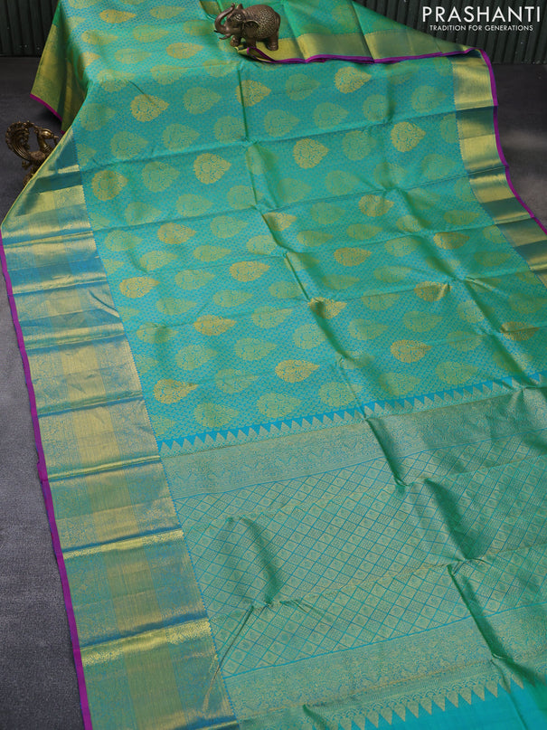 Pure kanchipuram silk saree dual shade of teal green and magenta pink with allover thread woven brocade weaves and rich zari woven border