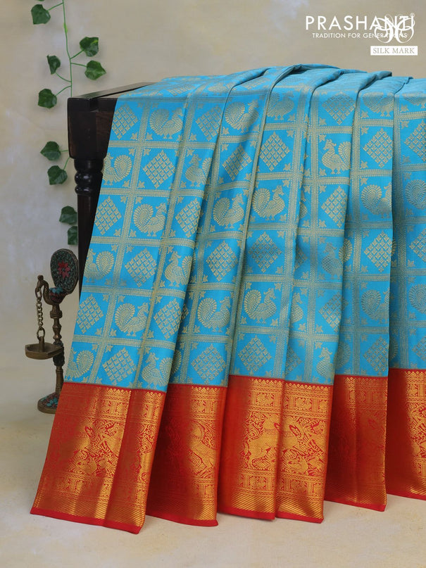 Pure kanchipuram silk saree light blue and red with allover zari woven brocade weaves and rich zari woven border