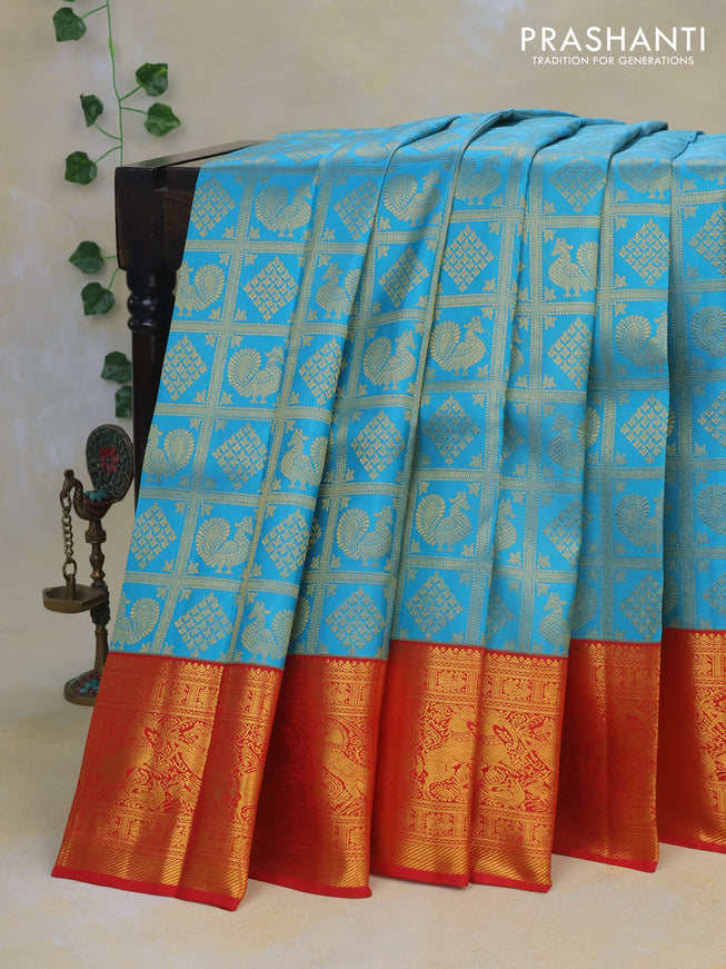 Pure kanchipuram silk saree light blue and red with allover zari woven brocade weaves and rich zari woven border