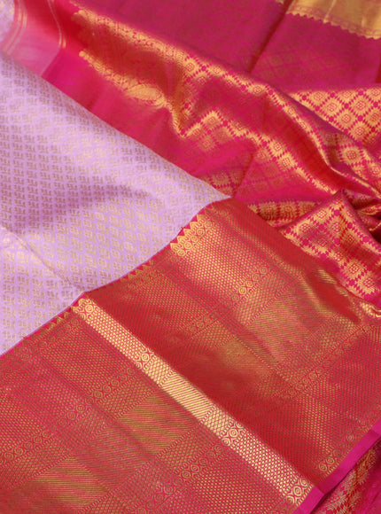 Pure kanchipuram silk saree mild lavender and pink with allover zari woven brocade weaves and long rich zari woven border