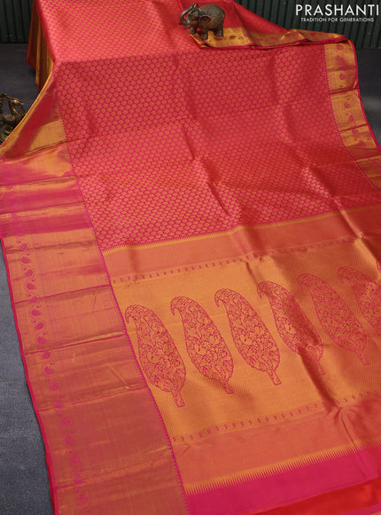 Pure kanchipuram silk saree dual shade of pinkish orange with allover zari woven brocade weaves and long rich zari woven border