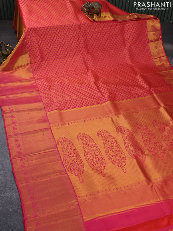 Pure kanchipuram silk saree dual shade of pinkish orange with allover zari woven brocade weaves and long rich zari woven border