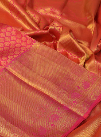 Pure kanchipuram silk saree dual shade of pinkish orange with allover zari woven brocade weaves and long rich zari woven border