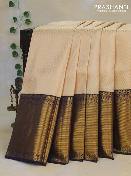 Pure kanchipuram silk saree cream and dark blue with allover zari woven brocade weaves and long rich zari woven border