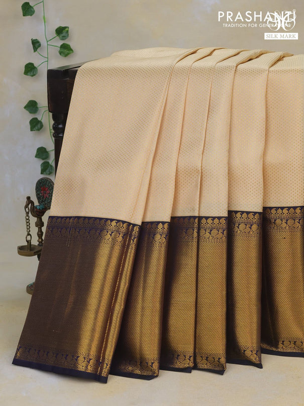 Pure kanchipuram silk saree cream and dark blue with allover zari woven brocade weaves and long rich zari woven border