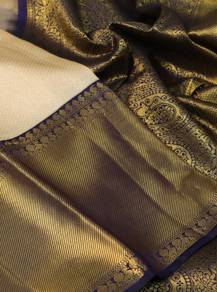 Pure kanchipuram silk saree cream and dark blue with allover zari woven brocade weaves and long rich zari woven border