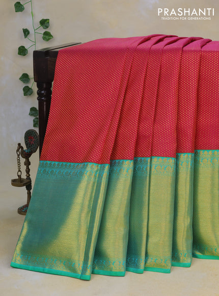 Pure kanchipuram silk saree pink and dual shade of teal bluish green with allover zari woven brocade weaves and long rich zari woven border