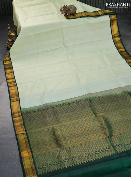 Pure kanchipuram silk saree pista green and bottle green with zari woven buttas and zari woven korvai border