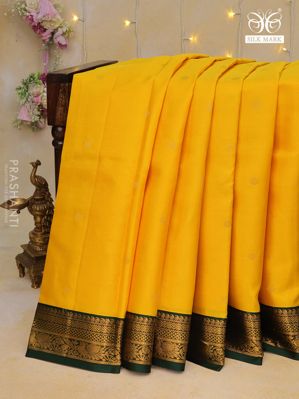 Pure kanchipuram silk saree mango yellow and dark green with allover zari weaves & buttas and zari woven korvai border