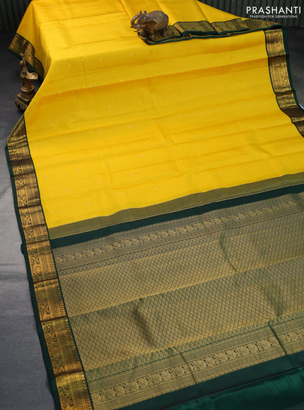 Pure kanchipuram silk saree mango yellow and dark green with allover zari weaves & buttas and zari woven korvai border