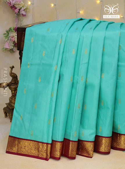 Pure kanchipuram silk saree teal blue and wine shade with zari woven buttas and zari woven korvai border