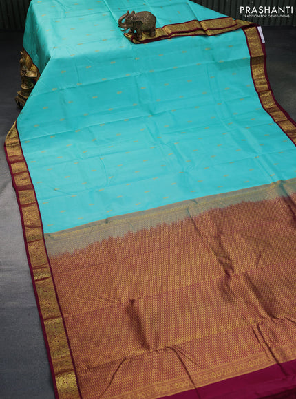 Pure kanchipuram silk saree teal blue and wine shade with zari woven buttas and zari woven korvai border