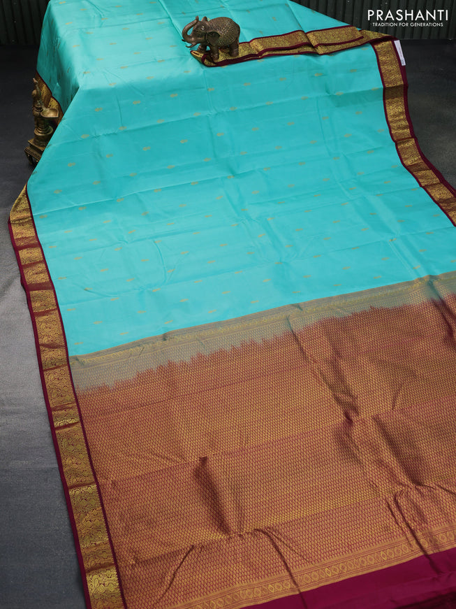 Pure kanchipuram silk saree teal blue and wine shade with zari woven buttas and zari woven korvai border