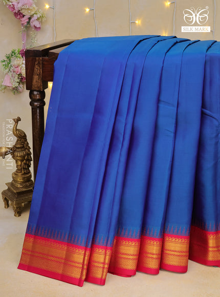 Pure kanchipuram silk saree dual shade of bluw and pink with plain body and temple design zari woven border