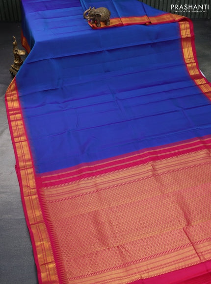 Pure kanchipuram silk saree dual shade of bluw and pink with plain body and temple design zari woven border