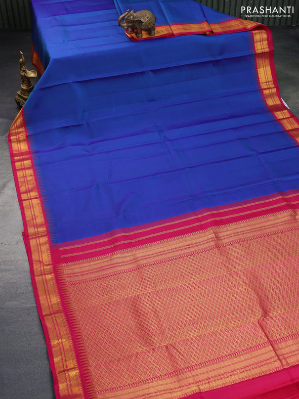 Pure kanchipuram silk saree dual shade of bluw and pink with plain body and temple design zari woven border