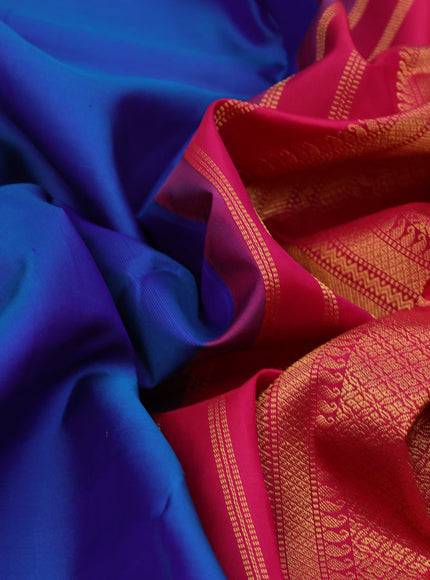 Pure kanchipuram silk saree dual shade of bluw and pink with plain body and temple design zari woven border