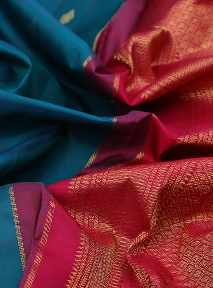 Pure kanchipuram silk saree teal green shade and pink with allover checks & zari buttas and zari woven korvai border