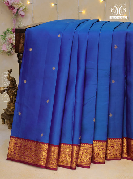 Pure kanchipuram silk saree dual shade of blue and wine shade with zari woven buttas and zari woven korvai border