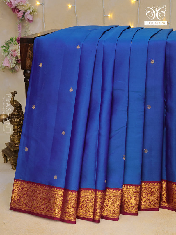 Pure kanchipuram silk saree dual shade of blue and wine shade with zari woven buttas and zari woven korvai border