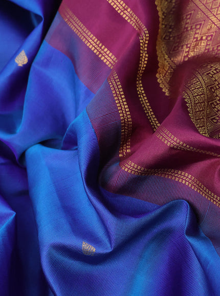 Pure kanchipuram silk saree dual shade of blue and wine shade with zari woven buttas and zari woven korvai border