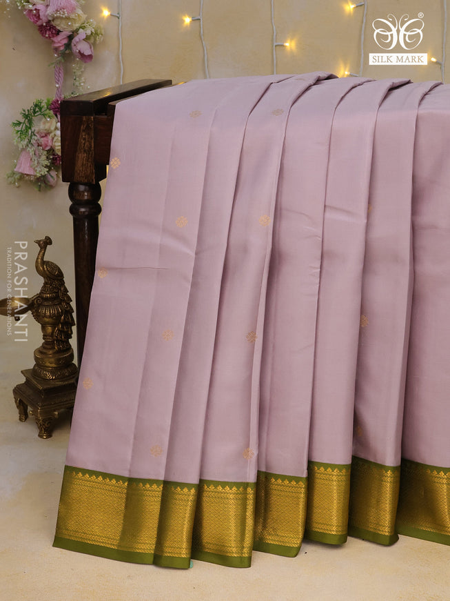 Pure kanchipuram silk saree pastel grey shade and mehendi green with zari woven buttas and zari woven korvai border