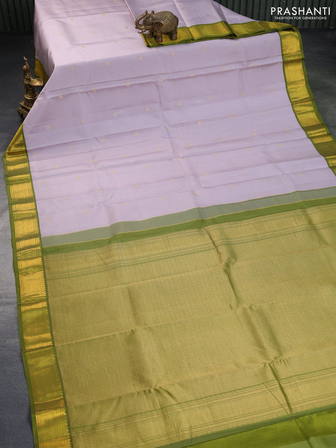 Pure kanchipuram silk saree pastel grey shade and mehendi green with zari woven buttas and zari woven korvai border