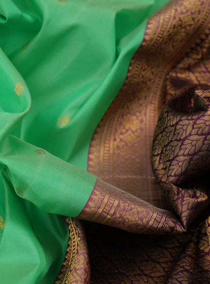 Pure kanchipuram silk saree teal green shade and deep violet with allover zari woven buttas and temple design zari woven border