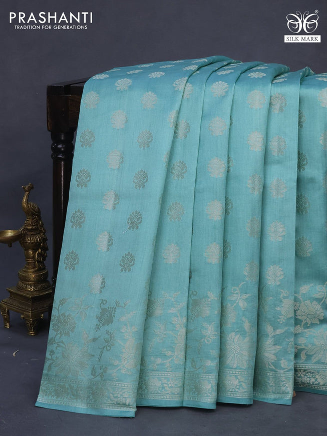 Chiniya silk saree pastel blue shade with allover zari woven buttas and silver zari woven border