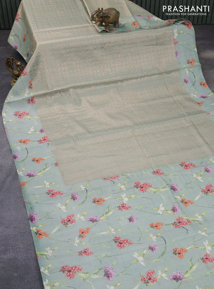 Banarasi silk saree pastel green with allover zari woven brocade weaves and floral digital printed border