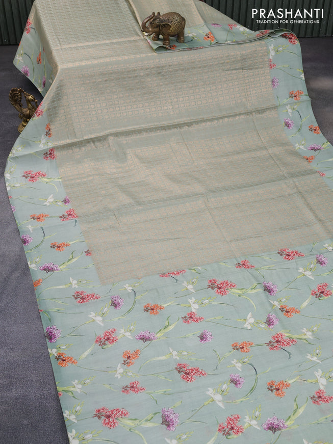 Banarasi silk saree pastel green with allover zari woven brocade weaves and floral digital printed border