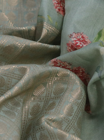 Banarasi silk saree pastel green with allover zari woven brocade weaves and floral digital printed border