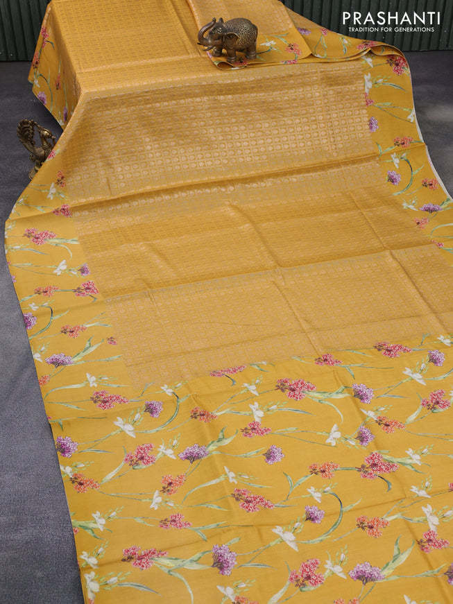 Banarasi silk saree mustard yellow with allover zari woven brocade weaves and floral digital printed border