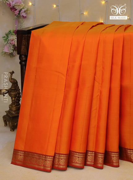 Pure kanchipuram silk saree orange with plain body and zari woven border