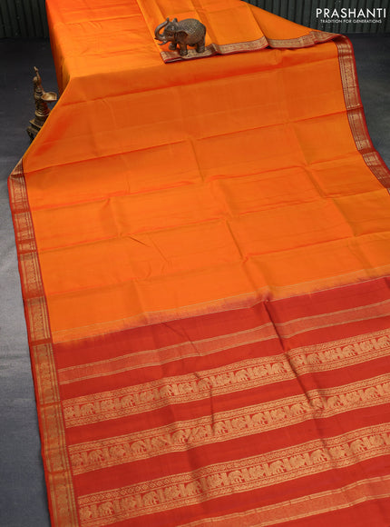 Pure kanchipuram silk saree orange with plain body and zari woven border