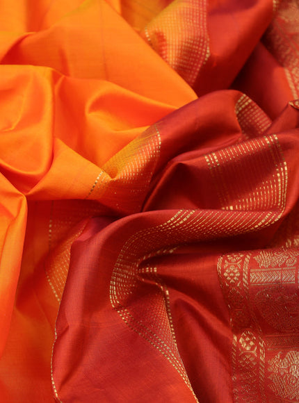 Pure kanchipuram silk saree orange with plain body and zari woven border