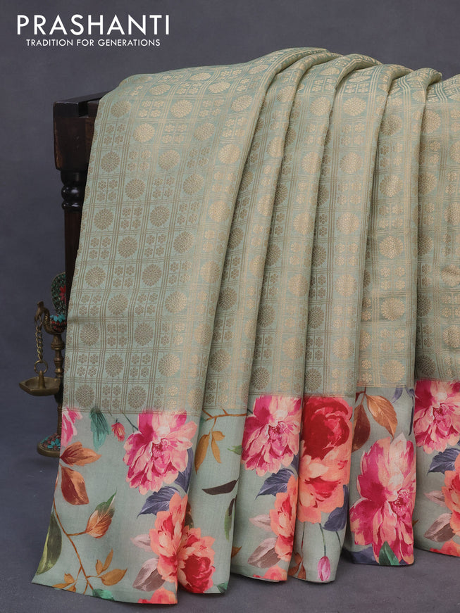 Banarasi silk saree pastel green with allover zari woven brocade weaves and floral digital printed border