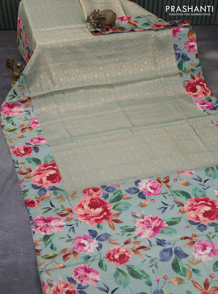 Banarasi silk saree pastel green with allover zari woven brocade weaves and floral digital printed border