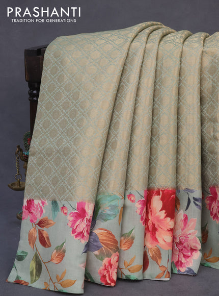 Banarasi silk saree pastel green with allover zari woven brocade weaves and floral digital printed border