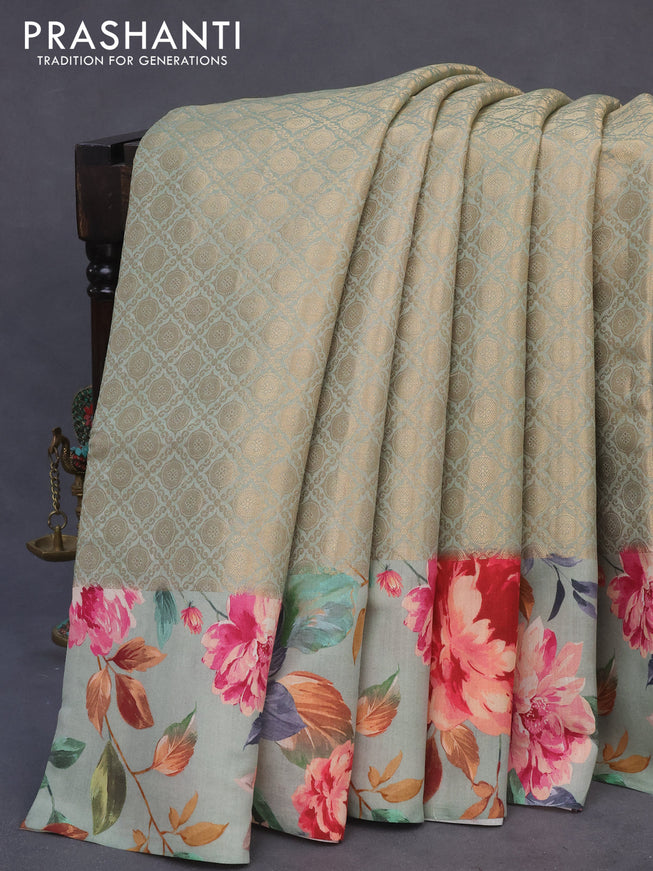 Banarasi silk saree pastel green with allover zari woven brocade weaves and floral digital printed border