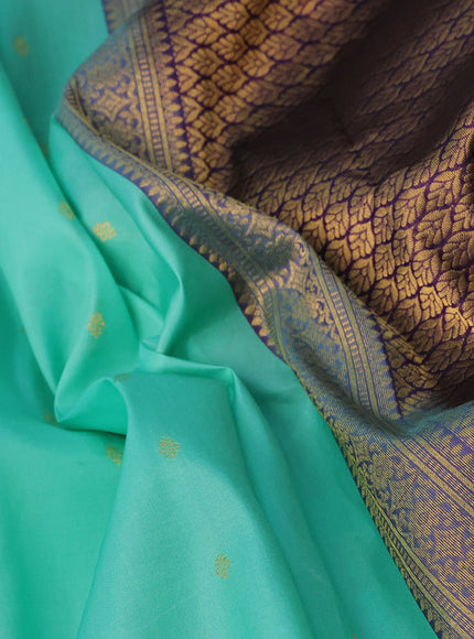 Pure kanchipuram silk saree teal blue and deep violet with allover zari woven buttas and temple design zari woven border