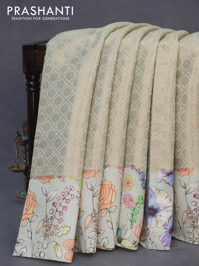 Banarasi silk saree pastel green shade with allover zari woven brocade weaves and floral digital printed border