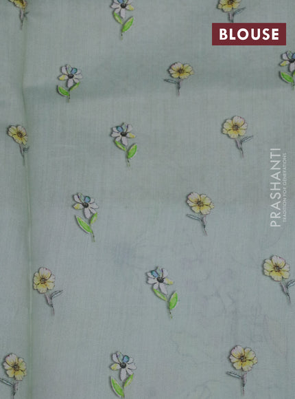 Banarasi silk saree pastel green shade with allover zari woven brocade weaves and floral digital printed border