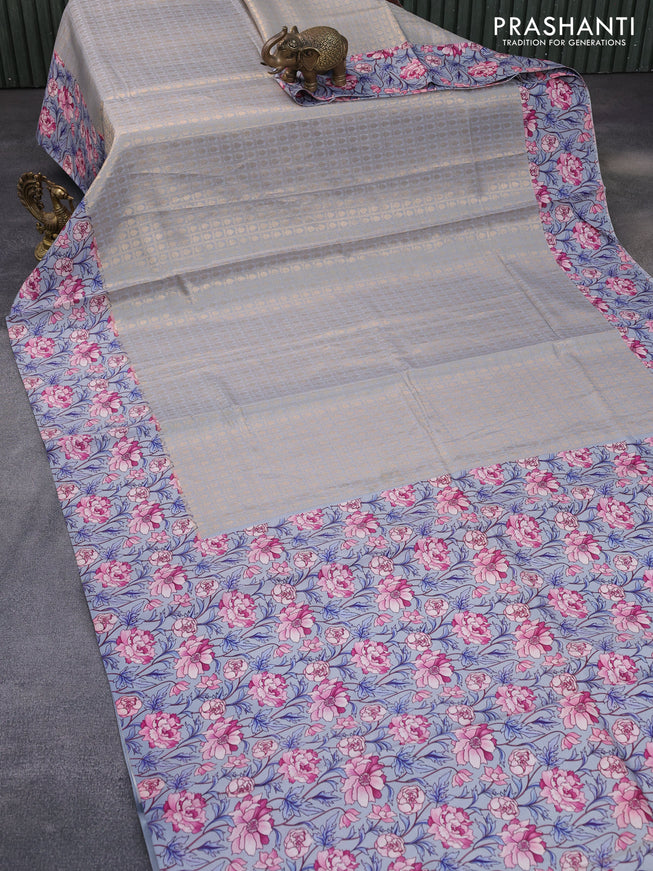 Banarasi silk saree grey shade with allover zari woven brocade weaves and floral digital printed border