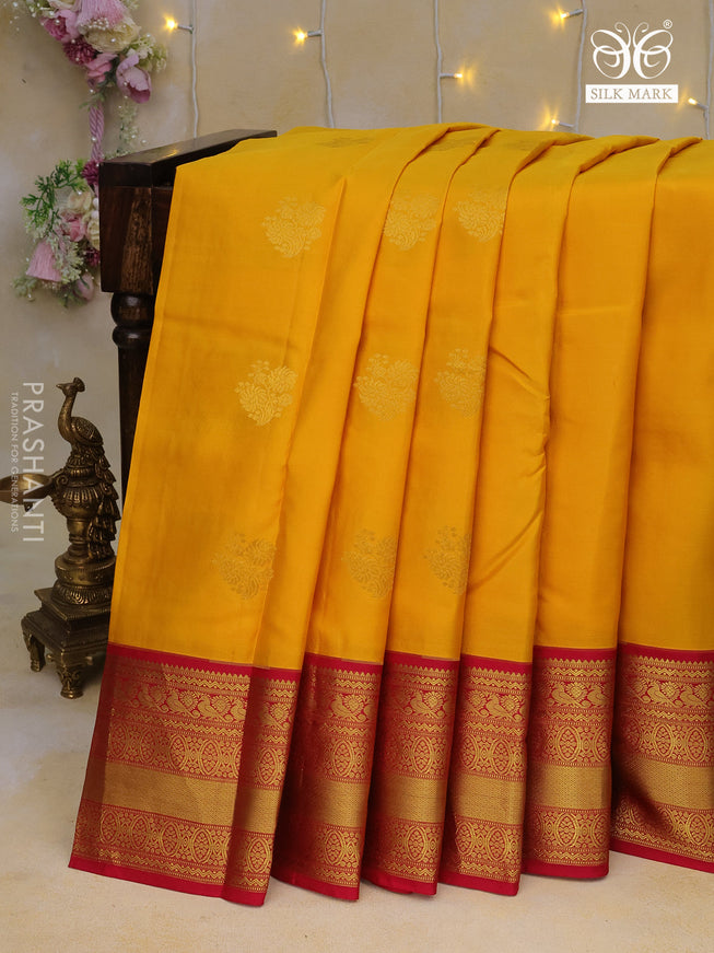 Pure kanchipuram silk saree yellow and pink with floral zari woven buttas and zari woven border