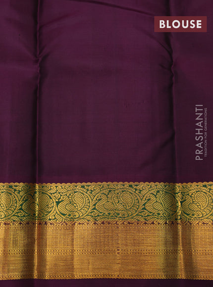 Pure kanchipuram silk saree mango yellow and deep purple with zari woven buttas and annam zari woven korvai border