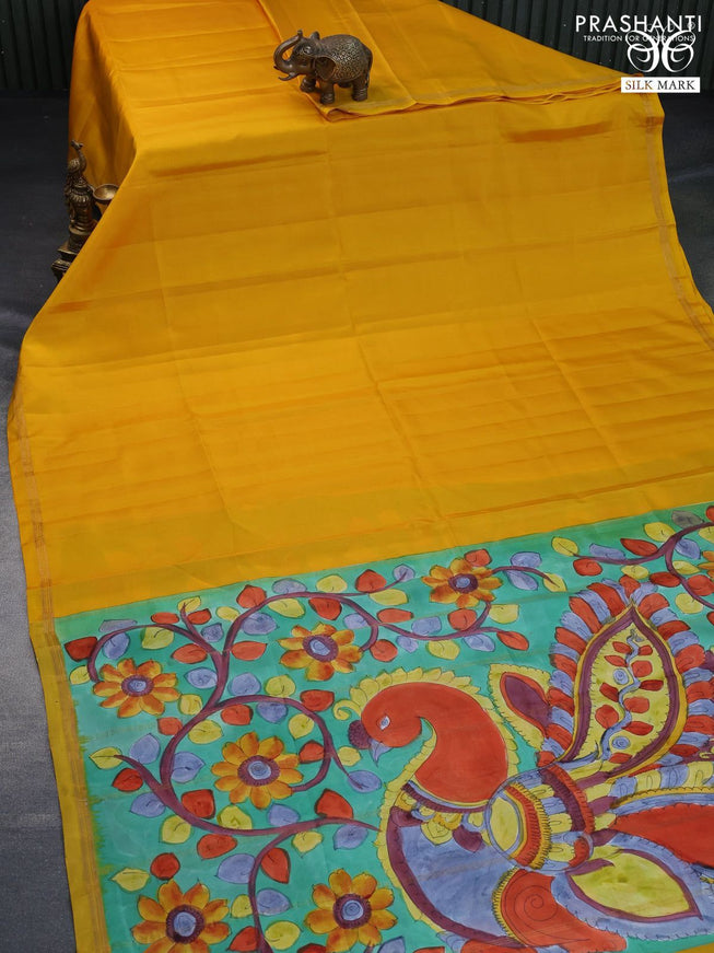 Pure soft silk saree mango yellow and teal green shade with plain body and pen kalamkari hand painted pallu