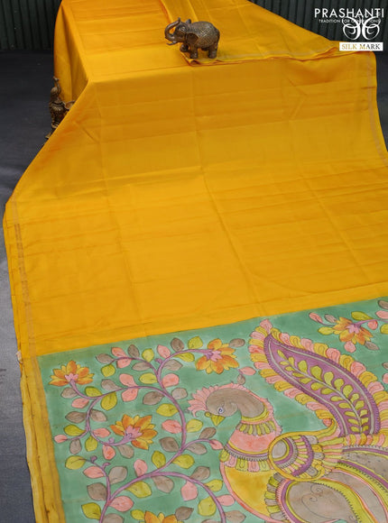 Pure soft silk saree mango yellow and pastel green with plain body and pen kalamkari hand painted pallu